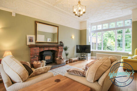 Left wing impressive sitting room with sun room si