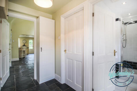 Entrance hallway with shower room and utility to r