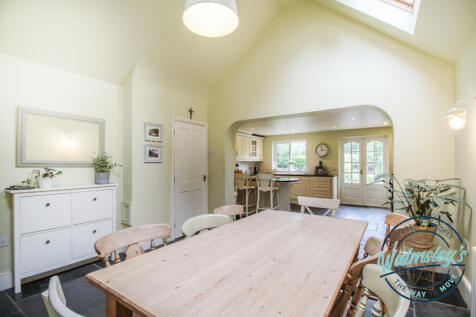 Right wing kitchen dining room with vaulted ceilin