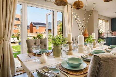 Your dining area looks over your garden through French doors