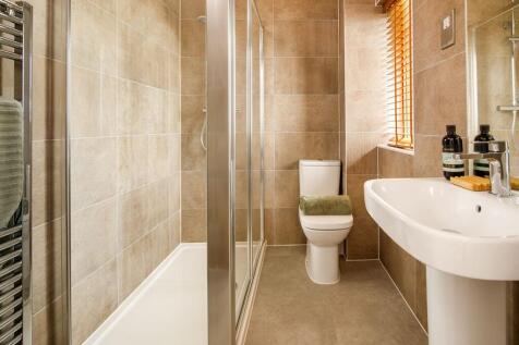 Bedroom 1 has a bright en suite to prepare for the day in