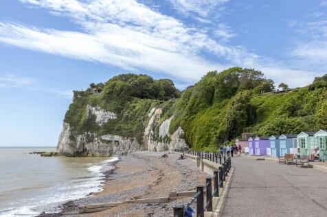 view of the white cliffs at Dover with beach huts