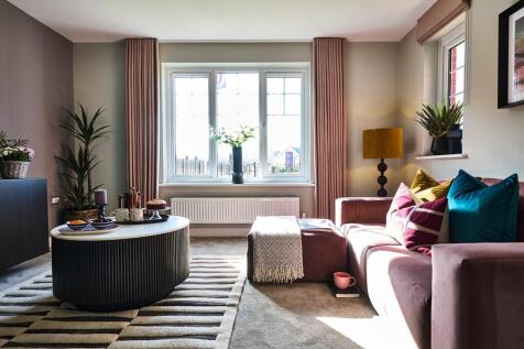 Large windows flood the living room with light