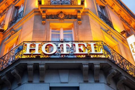 Illuminated hotel sign taken in Paris at night