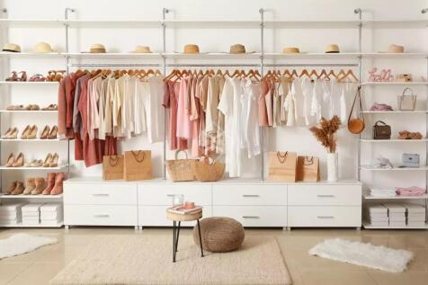 Interior of show room with stylish clothes and acc