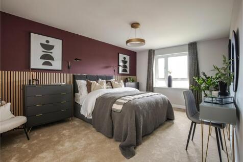 A luxurious main bedroom that stretches the full depth of the house.