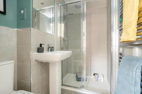 Bedroom 1 also hosts a private en-suite shower room