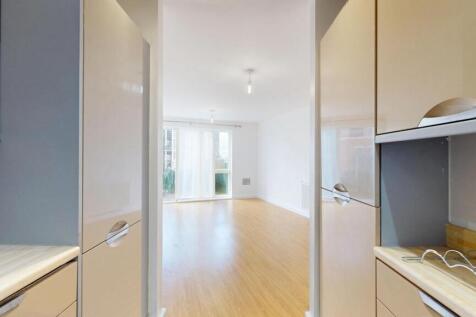 Bright and inviting living room with ample natu...