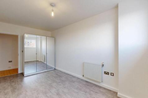 Bright and clean double bedroom featuring neutr...