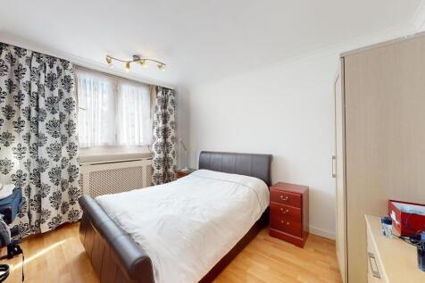 A bright and welcoming double bedroom featuring...