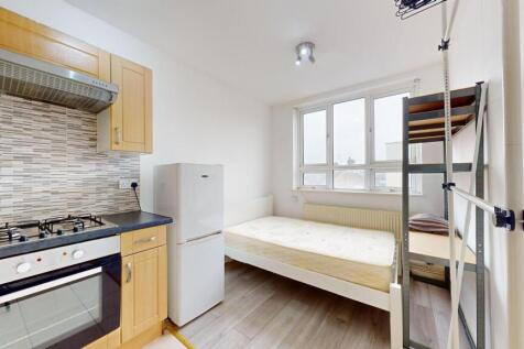 Bright and airy living space featuring large wi...