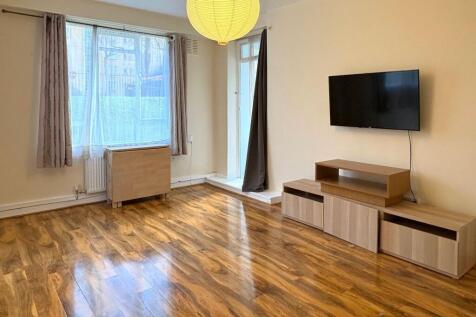 Bright, well-presented living room with large w...