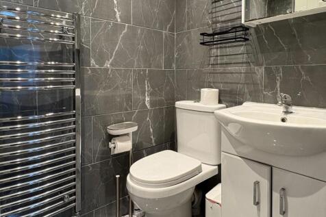 Contemporary tiled bathroom with modern fixture...