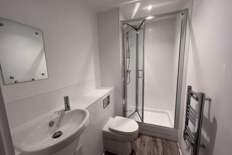 A modern and clean bathroom featuring a stylish...