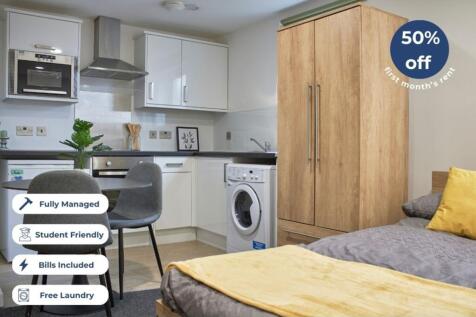 This modern kitchen area features a stylish des...