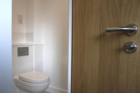 A modern and tidy single toilet with clean line...