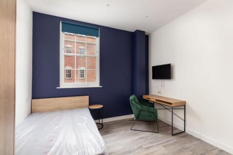 A modern and spacious double bedroom featuring ...