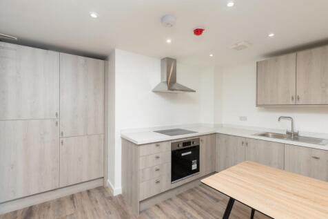 A modern and tidy kitchen with ample storage an...