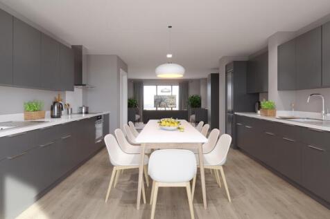 A spacious and modern kitchen with ample dining...