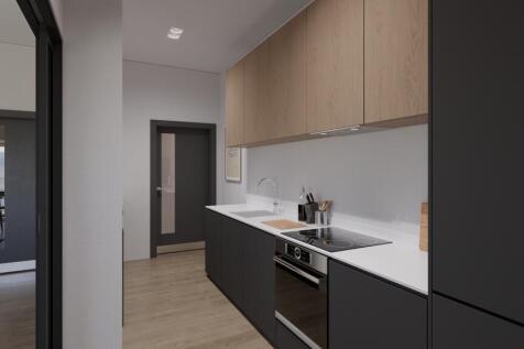 A modern and tidy kitchenette featuring sleek c...