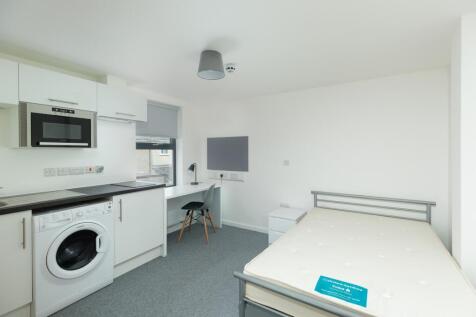 A bright and spacious double bedroom featuring ...