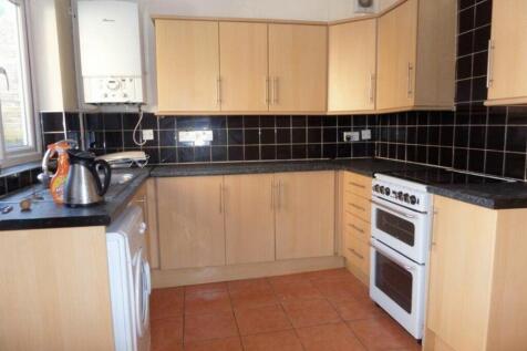 A bright and functional kitchen with modern cab...