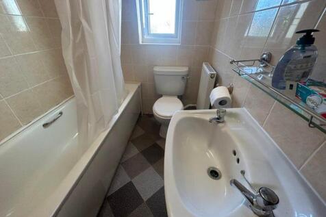 A clean and well-maintained bathroom featuring ...