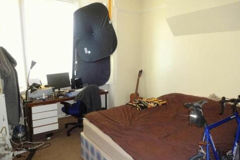 A cozy double bedroom with a comfortable bed an...