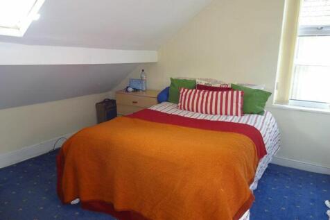 A cozy and inviting double bedroom with bright ...