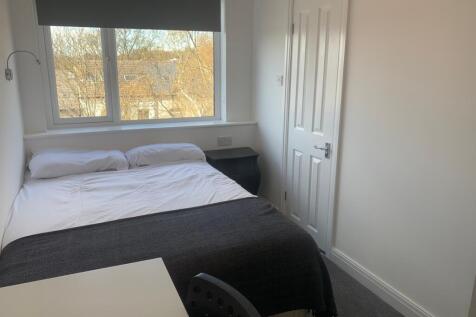Bright and inviting double bedroom featuring a ...