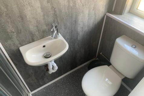 A well-maintained single toilet featuring moder...