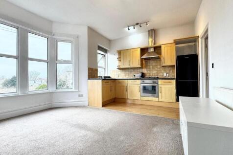 Bright and spacious kitchen area featuring mode...