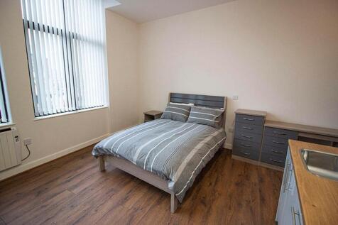 This inviting double bedroom features large win...