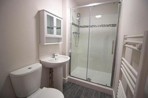 Bright and modern bathroom featuring a stylish ...