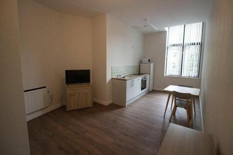 A bright and inviting kitchen area featuring mo...