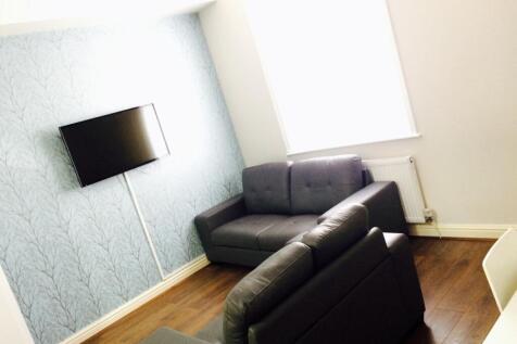 A bright and inviting living room featuring mod...