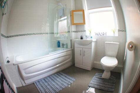 A bright and well-maintained bathroom featuring...