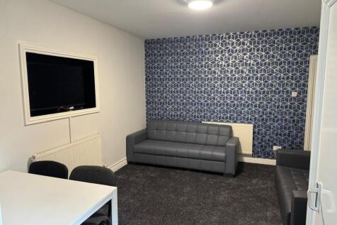A modern and inviting living room featuring sty...