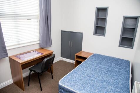 A cozy double bedroom featuring a comfortable m...