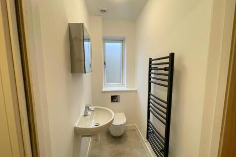 Modern bathroom featuring sleek fixtures and am...