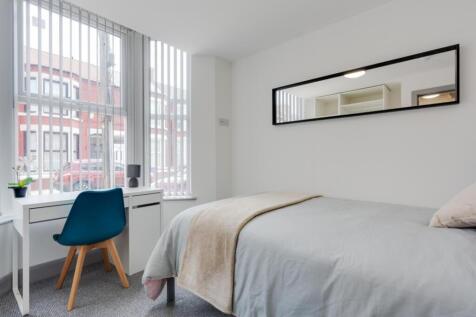 A bright and inviting double bedroom featuring ...