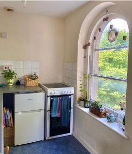 Charming kitchen featuring ample counter space,...