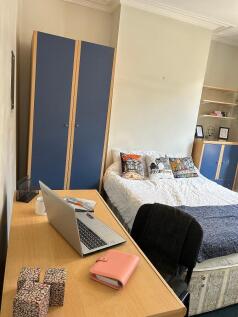 This charming double bedroom offers a cozy retr...