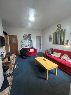 Bright and inviting living room featuring comfo...