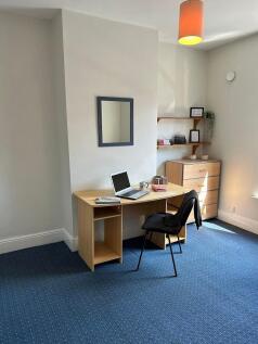Bright and inviting study area featuring a spac...