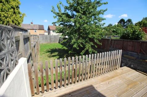 A spacious garden area featuring a well-maintai...