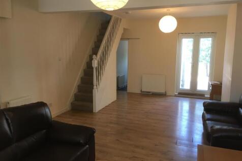 Spacious living room featuring contemporary des...