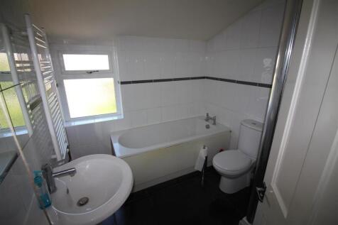 This bright bathroom features a spacious layout...