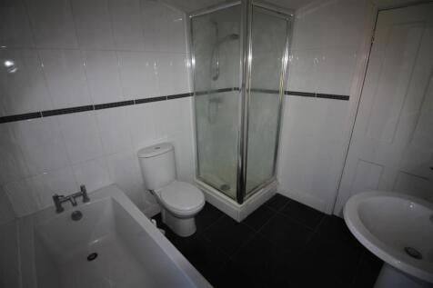 This well-appointed bathroom features a modern ...