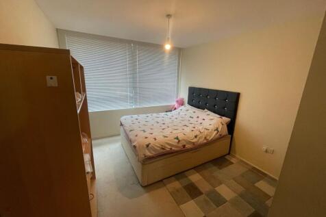 A cozy double bedroom featuring a comfortable d...